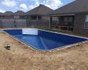 This pool install is being finished and is going to be a great addition for this home.