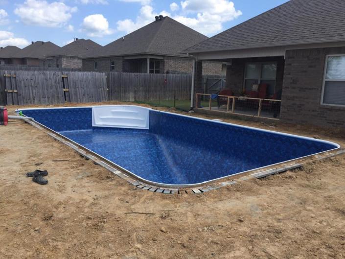 This pool install is being finished and is going to be a great addition for this home.