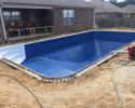 A pool install in progress that's going to be a great addition to this home.