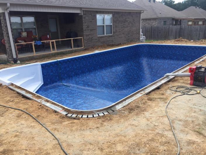 A pool install in progress that's going to be a great addition to this home.